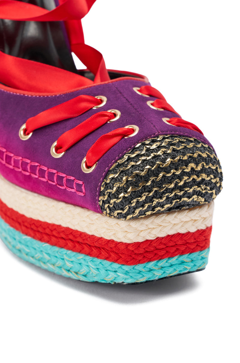 The AKIRA GOLD FONTEYN RED MULTI CHUNKY PLATFORM LACE UP PUMP showcases a vibrant purple upper, red laces, gold eyelets, a black and gold woven toe, and layered soles in cream, teal, and red for retro style. 6