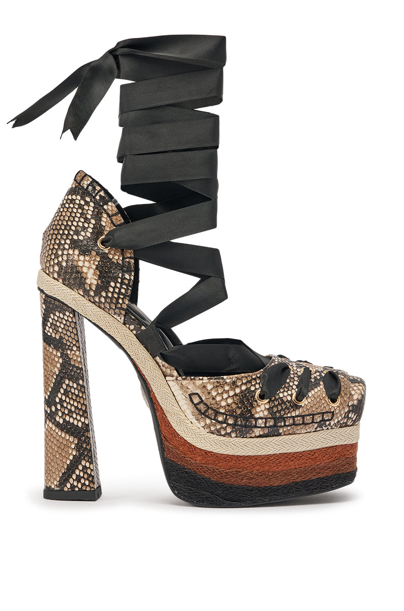 The AZALEA WANG FONTEYN SNAKE PLATFORM PUMP features high heels, faux leather, a bold snakeskin pattern, chunky block heel, brown and black striped sole, and black ribbon laces that wrap around the ankle. 4