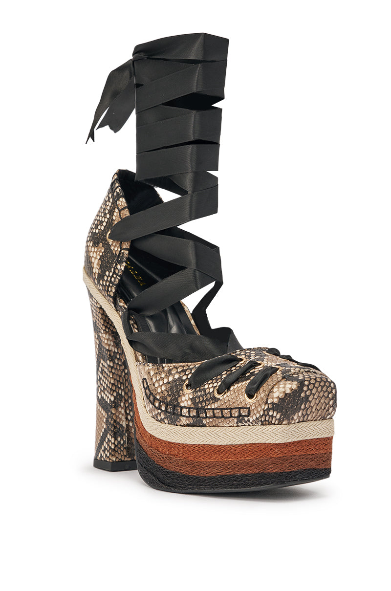 The AZALEA WANG FONTEYN SNAKE PLATFORM PUMP is a high-heeled, snake-embossed faux leather shoe with layered brown and black soles, cut-out sides, and wide black ribbon ankle straps—an eye-catching platform pump. 5