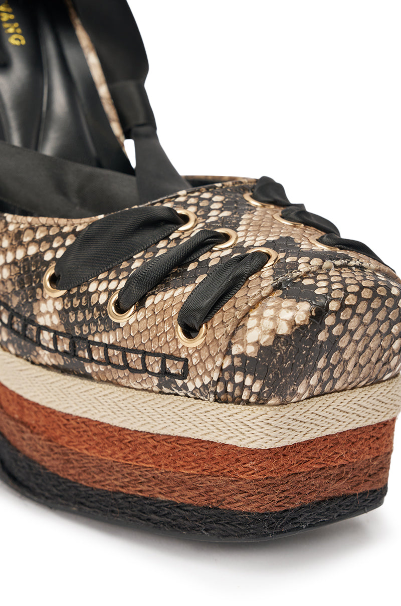 Close-up of the AZALEA WANG FONTEYN SNAKE PLATFORM PUMP featuring a snake-embossed finish, black ribbon laces, and a thick layered sole in black, beige, and reddish-brown tones. 7