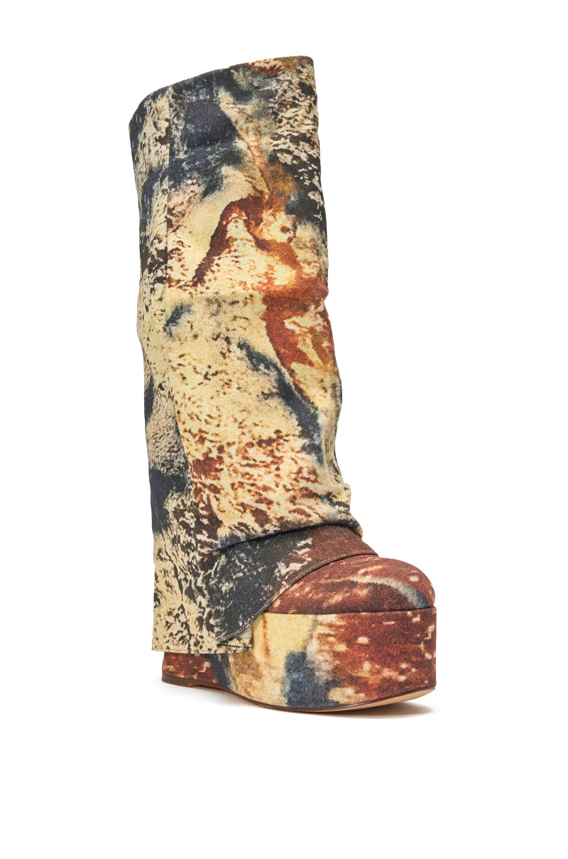 The AZALEA WANG FRANKEYE MULTI MATERIAL FLATFORM BOOT is a knee-high wedge with a slouchy shaft and a multicolored abstract design in earthy beige, brown, blue, and orange tones. 3
