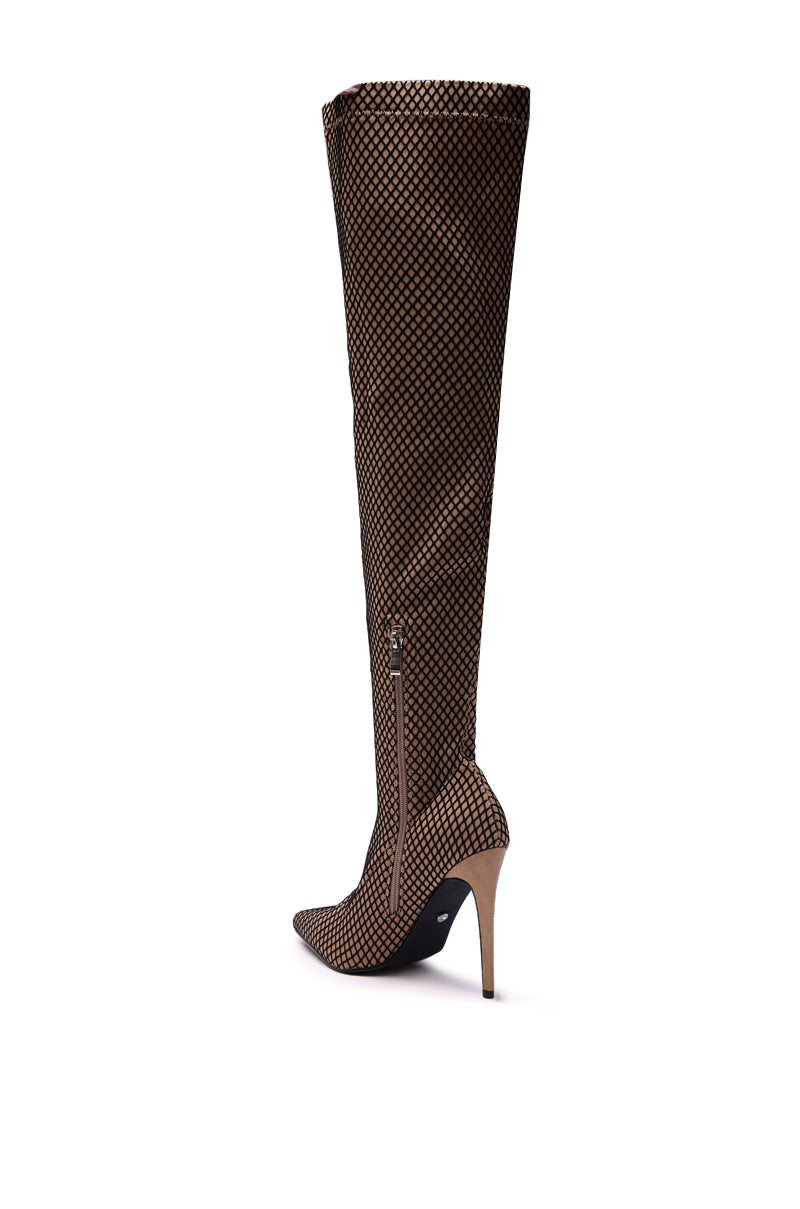 The AZALEA WANG FREEDAH NUDE FISHNET LOOK STILETTO BOOT is a single knee-high, pointed-toe stiletto boot with a beige and black diamond-patterned mesh and side zipper, displayed against a white background.