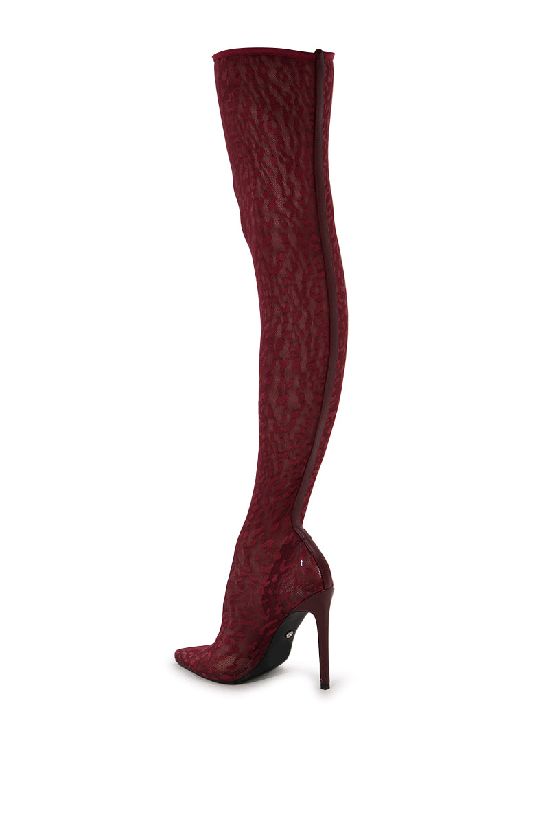 The AZALEA WANG FREJYA BURGUNDY LEOPARD LACE THIGH HIGH BOOT is a single high-heeled boot in deep red with a pointed toe, leopard-patterned lace fabric, a slender stiletto heel, and a convenient side zipper.
