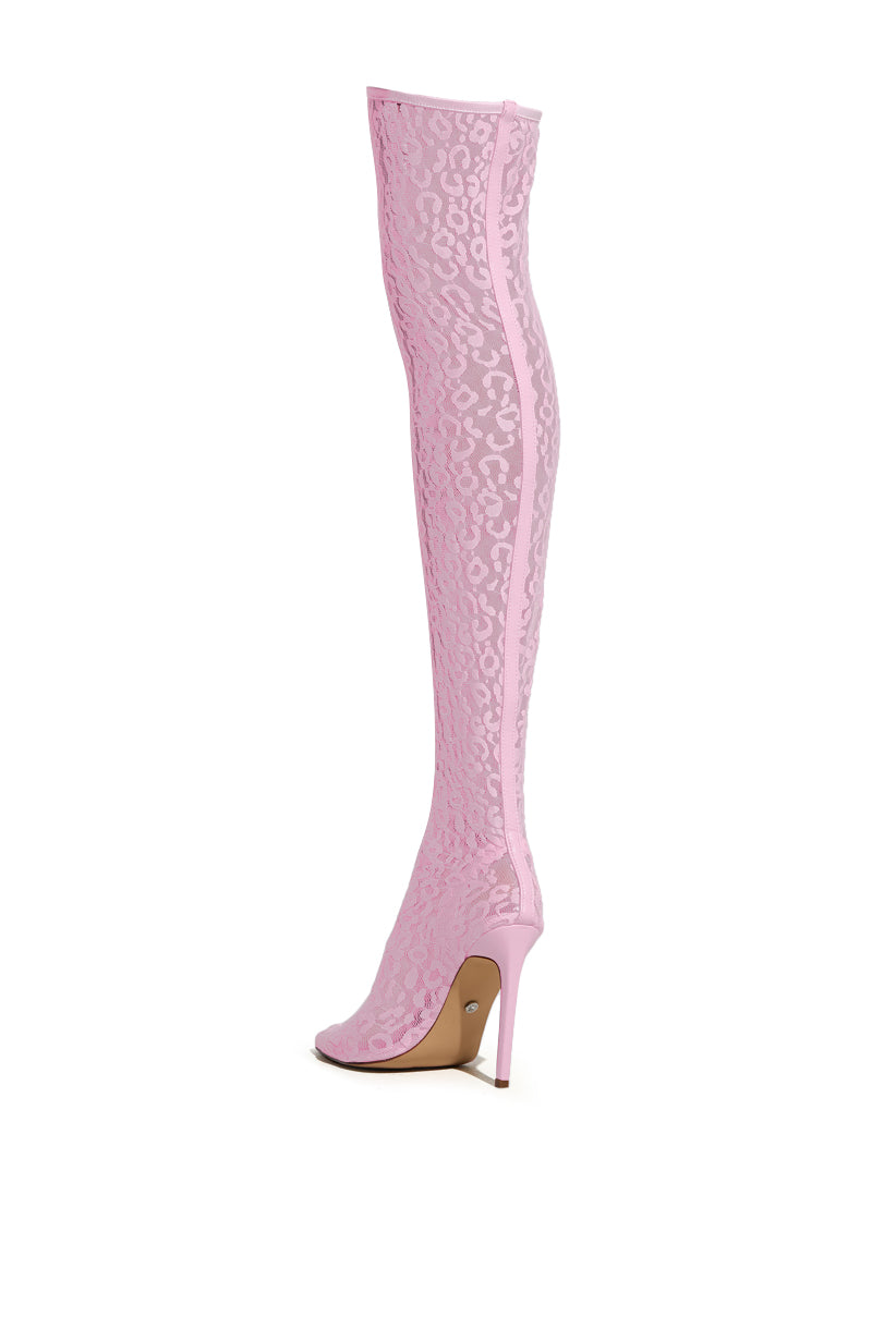 The AZALEA WANG FREYJA OVER THE KNEE LACE BOOT IN PINK is a sleek pink thigh-high boot with a stiletto heel, featuring a striking leopard print lace overlay. Its design includes an open toe and a convenient vertical zipper closure on the inner side.
