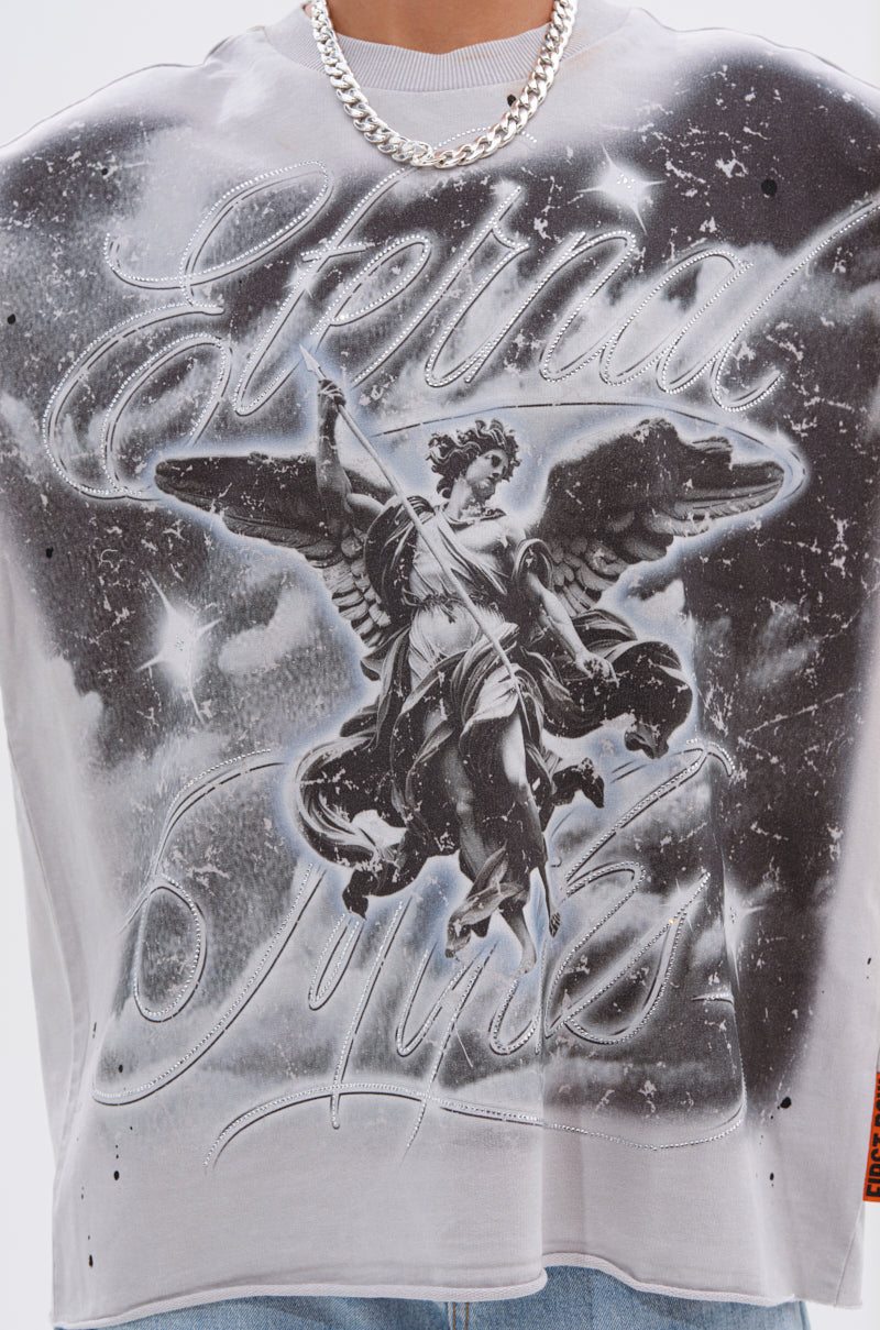 A person in a silver chain and the BOUNCE BACK OVERSIZED TEE, with a bold black-and-white graphic of a winged angel statue, stars, and "Eternal Styles" in cursive, captures true grunge graphic t-shirt style.
