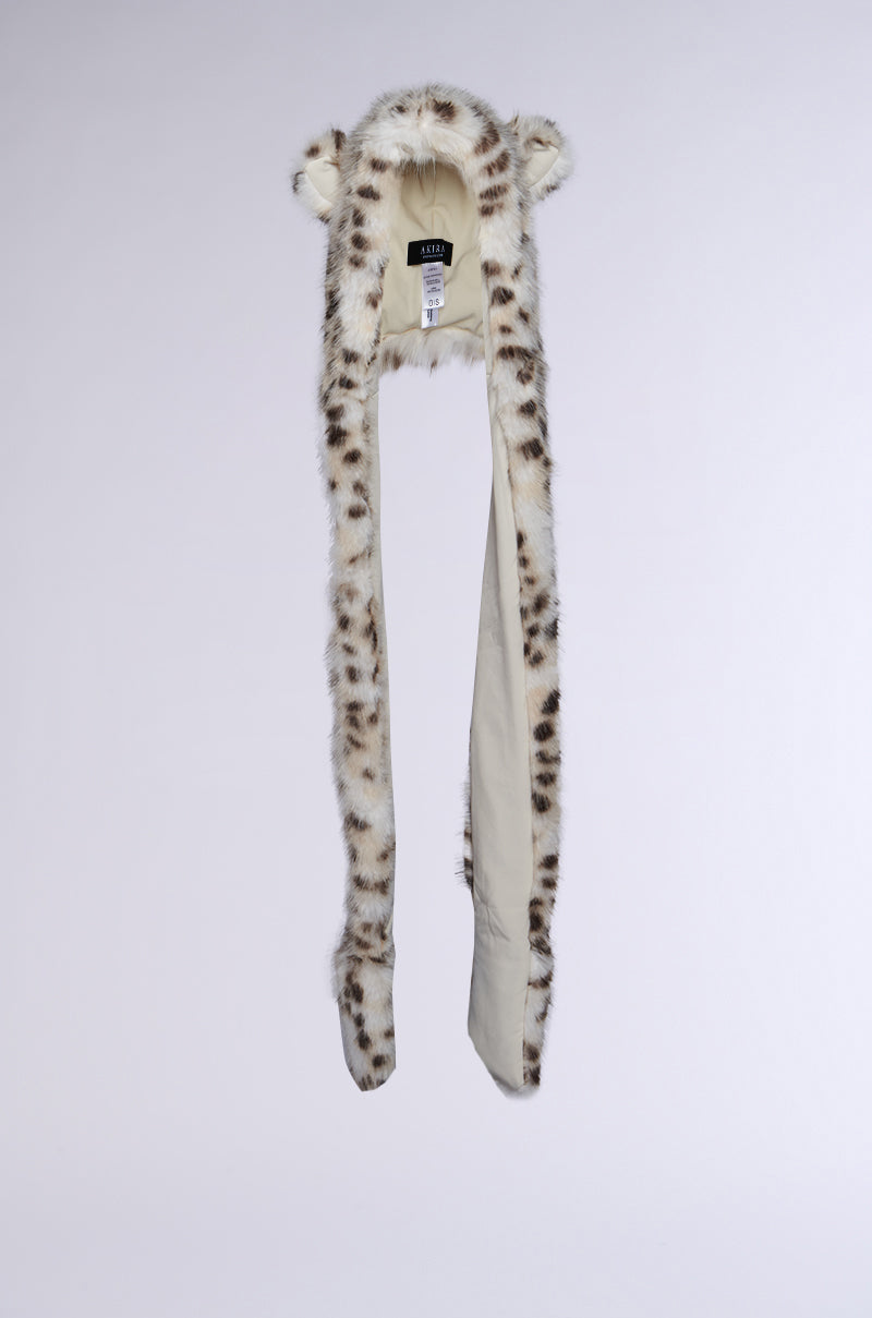 The ANIME DREAMIN FAUX FUR HOOD is an adorable scarf designed like a snow leopard, complete with long ends that look like paws, small ears on top, and crafted from faux fur. It is showcased against a plain backdrop. 5