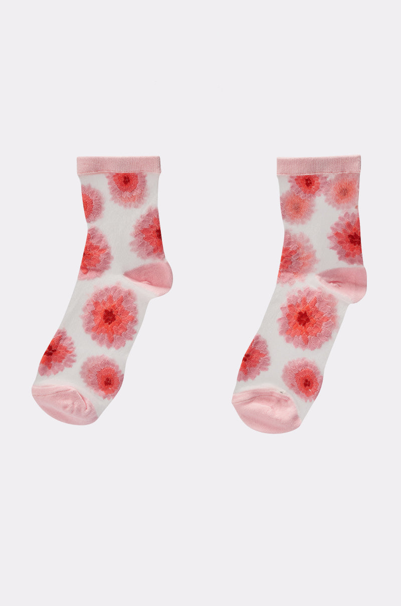 The WHERES MY HEEL SOCKS are white socks with a floral pattern, pink toes, heels, and cuffs, and feature bold pink and red flower prints for a playful look. 3