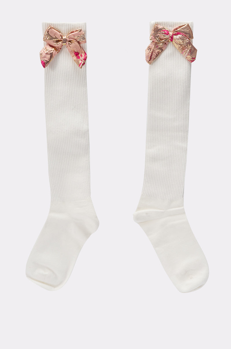 DOLLED UP BOW SOCKS: Ivory knee-high socks topped with shiny pink and gold brocade bows. 2