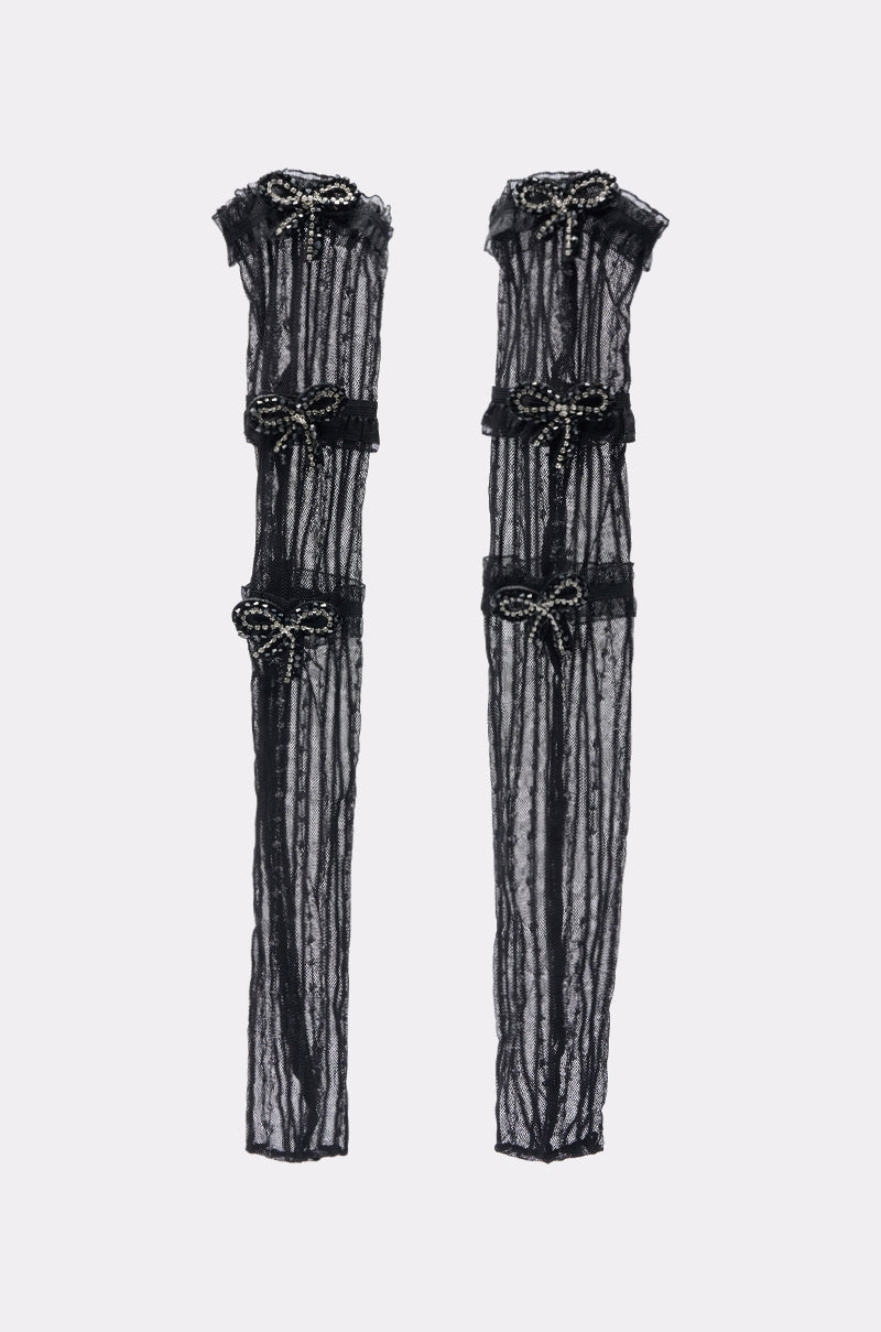PRETTY N PROPER BOW SOCKS—black lace socks featuring three decorative rhinestone bows on each, shown against a plain white background. 1