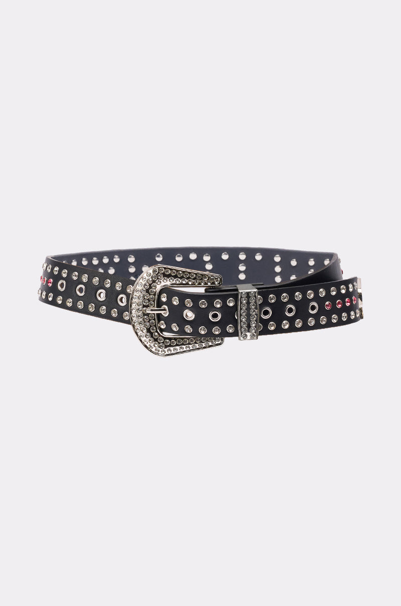 The I AM THAT BELT is a black faux leather belt featuring silver and pink crystal studs and a large, ornate western buckle, shown against a plain white background. 4