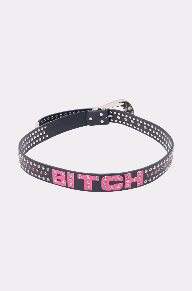 The “I AM THAT BELT” choker is a black faux leather accessory with silver rivets and "BITCH" in bold hot pink letters, styled like a crystal stud belt and shown laid flat on a plain white background. 8