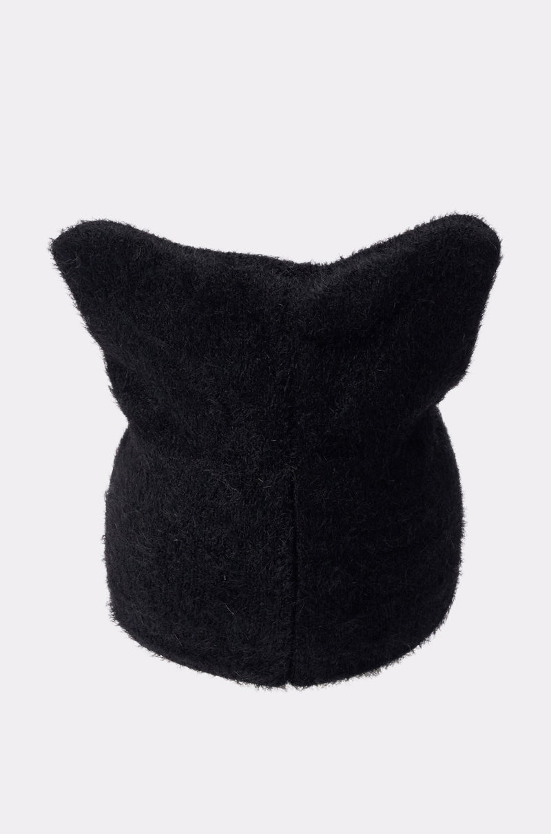 The IT GURL BEANIE is a black soft knit hat featuring two pointed cat ear-like shapes on top, shown against a plain white background. 3