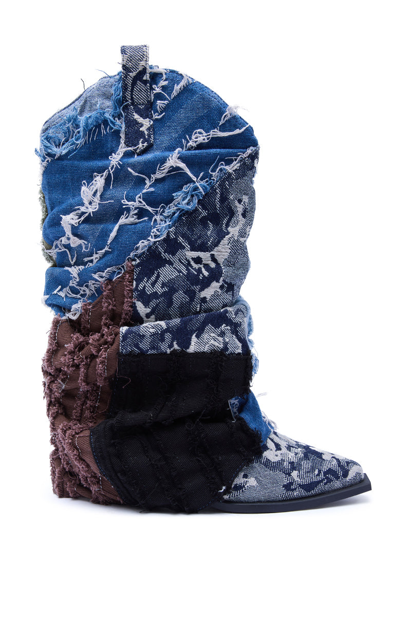The AZALEA WANG GABRYLE MULTI MATERIAL WESTERN BOOTIE features frayed denim patches in blue, black, and brown tones, visible stitching, a chunky heel, and a pointed toe. Photographed on a white background.