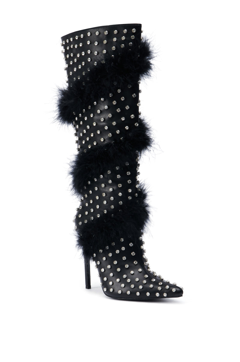 The AZALEA WANG GARDENIA FEATHER EMBELLISHED BOOT IN BLACK is a high-heeled faux leather boot with pearl-like studs and black feather trim spiraling from top to toe, featuring a pointed toe and sleek stiletto heel.