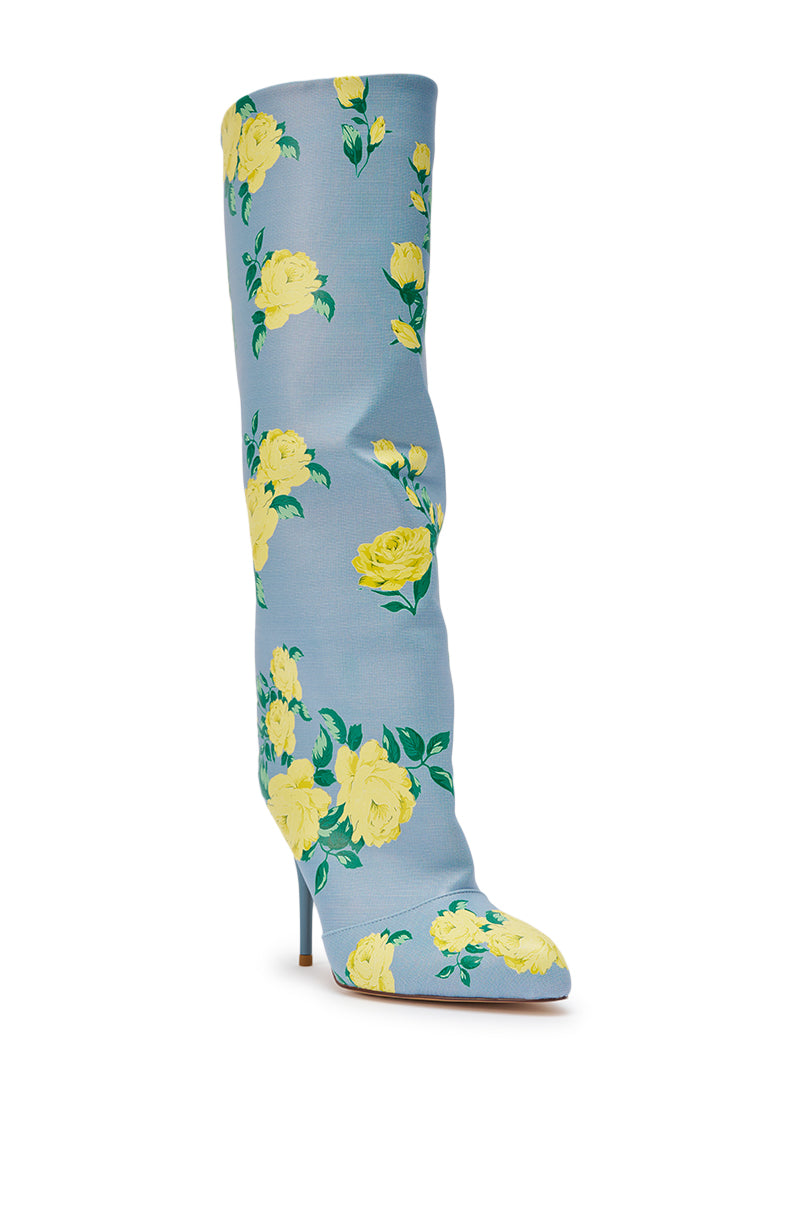 The AKIRA GOLD GARLAND BLUE FLORAL BOOT is a knee-high, pointed-toe stiletto crafted from blue faux leather with a chic yellow rose and green leaf print. 6