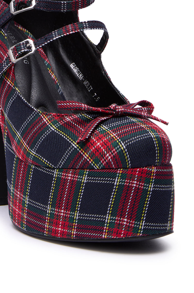 The AZALEA WANG GEORGINA MULTI PLAID CHUNKY PUMP features red, green, yellow, and white tartan fabric, double Mary Jane buckles, a bow detail at the toe, and a bold platform heel for standout style.