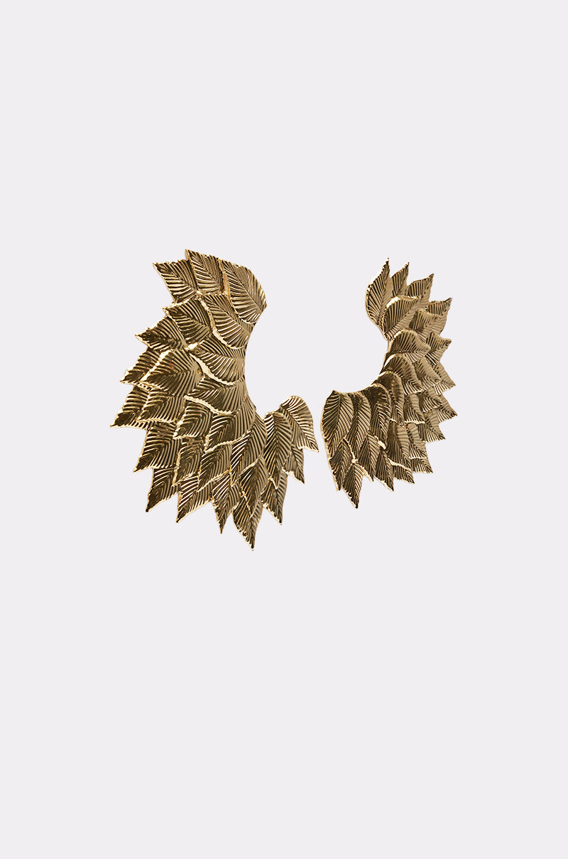 SUNSHINE EARRING: Gold leaf statement earrings with stylized wing or layered leaf shapes and intricate textured detailing, shown against a simple light background for a bold, elegant look. 2