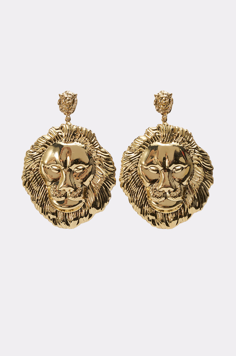 The ROAR EARRING features a pair of gold-tone lion head earrings with detailed manes and a smaller textured gold piece at the top for the ear post. 0
