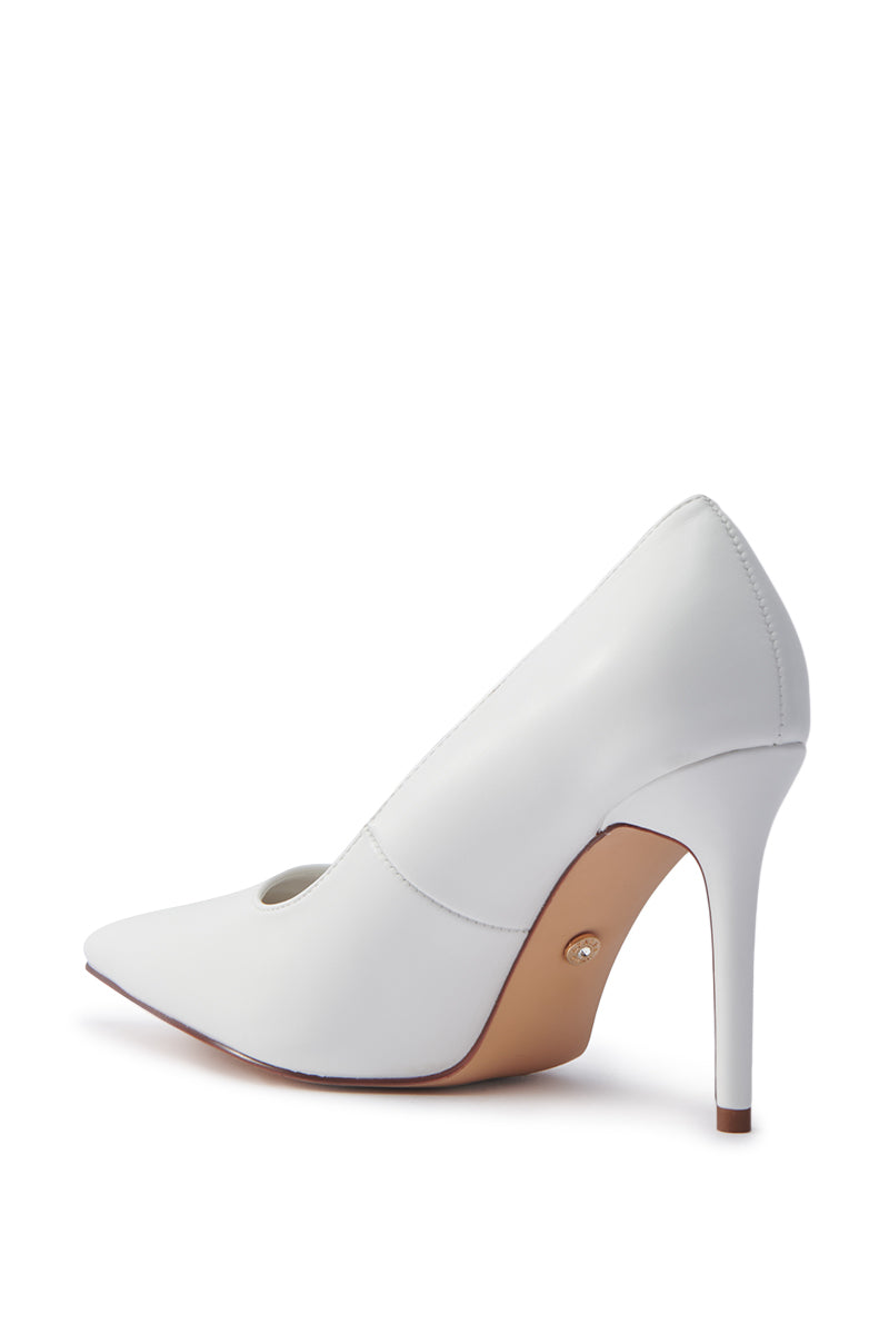 The AKIRA Ginny White Pump features a faux leather upper, sleek pointed toe, and a stiletto heel with a light brown bottom. Displayed against white, it exudes sophisticated style. 5
