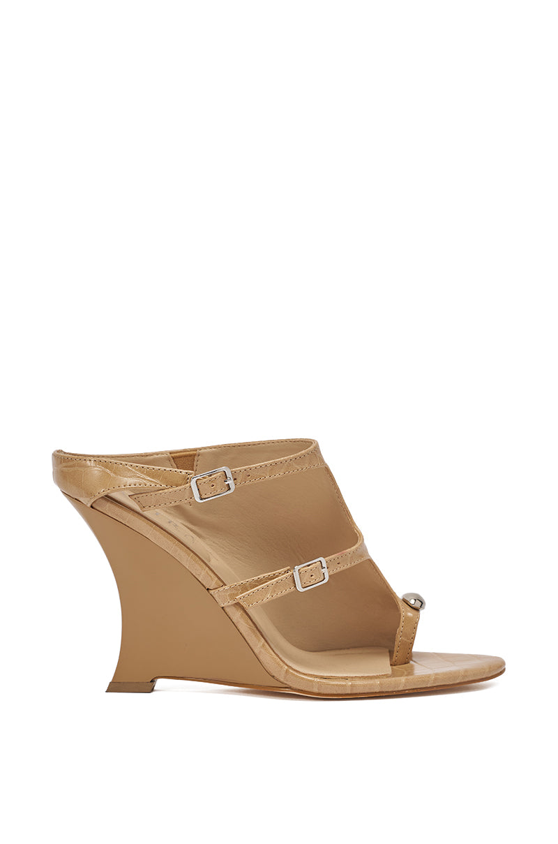 The AKIRA GOLD GINO NUDE CROC WEDGE SANDAL features tan faux croc-leather, a unique angular heel, two thin buckle straps, toe loop, open back, and comfort cushion insole. Shown on a white background. 3
