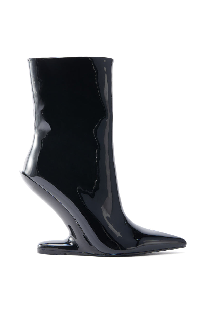 The AZALEA WANG GLACIELLE PATENT BLACK WEDGE BOOTIE is a sleek, black pointed toe bootie featuring a high-gloss faux patent leather finish and a curved sculptural heel for a unique, modern silhouette with minimalistic and bold design.