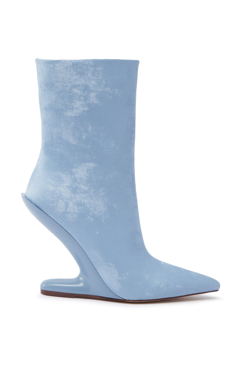The AZALEA WANG GLACIELLE BLUE WEDGE BOOTIE is a high-fashion light blue suede bootie with a sculptural wedge heel and pointed toe, shown against a white background.