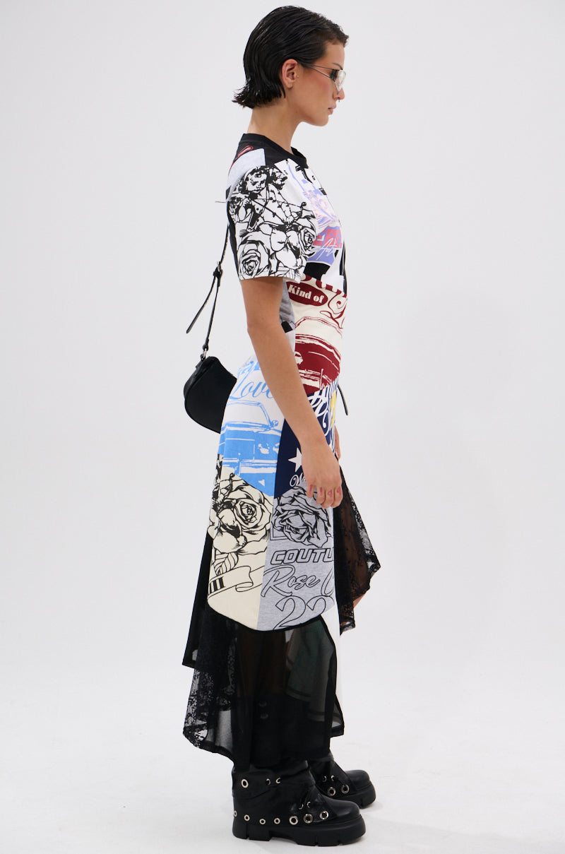 A person with short dark hair, sunglasses, and a small black shoulder bag stands sideways against a plain white background, wearing the YOU WERE THE ONE PATCHWORK MIDI DRESS over a black lace skirt and black boots with metal details.