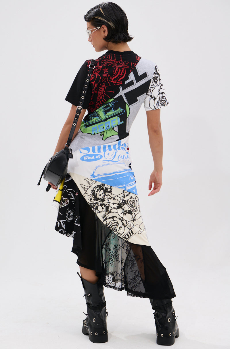 A person with short hair faces away, wearing the YOU WERE THE ONE PATCHWORK MIDI DRESS with graphic prints and lace details, styled with boots, a black crossbody bag, and clear sunglasses against a plain white background.