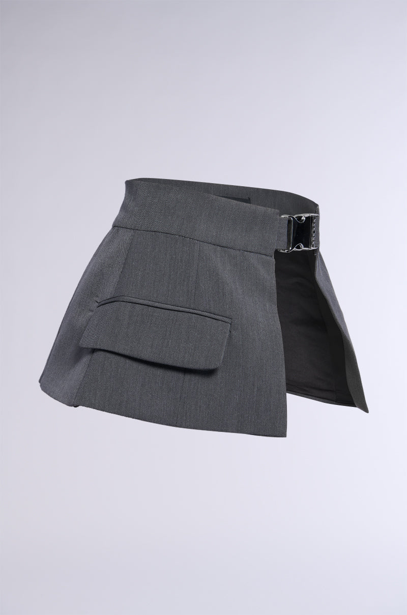 A dark gray, high-waisted mini skirt with the UTILTY CHIC BELT, which features a metallic silver buckle and a large front flap pocket. The skirt is displayed against a plain, light background.