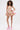 A woman with curly hair models the PRETTY IN PINK BROCADE MINI DRESS, a strapless metallic dress with a gold, pink, and white floral pattern and flared skirt, paired with light pink platform heels against a plain white background.