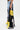 A person wears the DONT MESS WITH ME WIDE LEG DENIM PANT in light blue with a high-rise fit, featuring yellow, black, and white sports jersey panels with large numbers and lace details; only the side view of their lower body is visible.