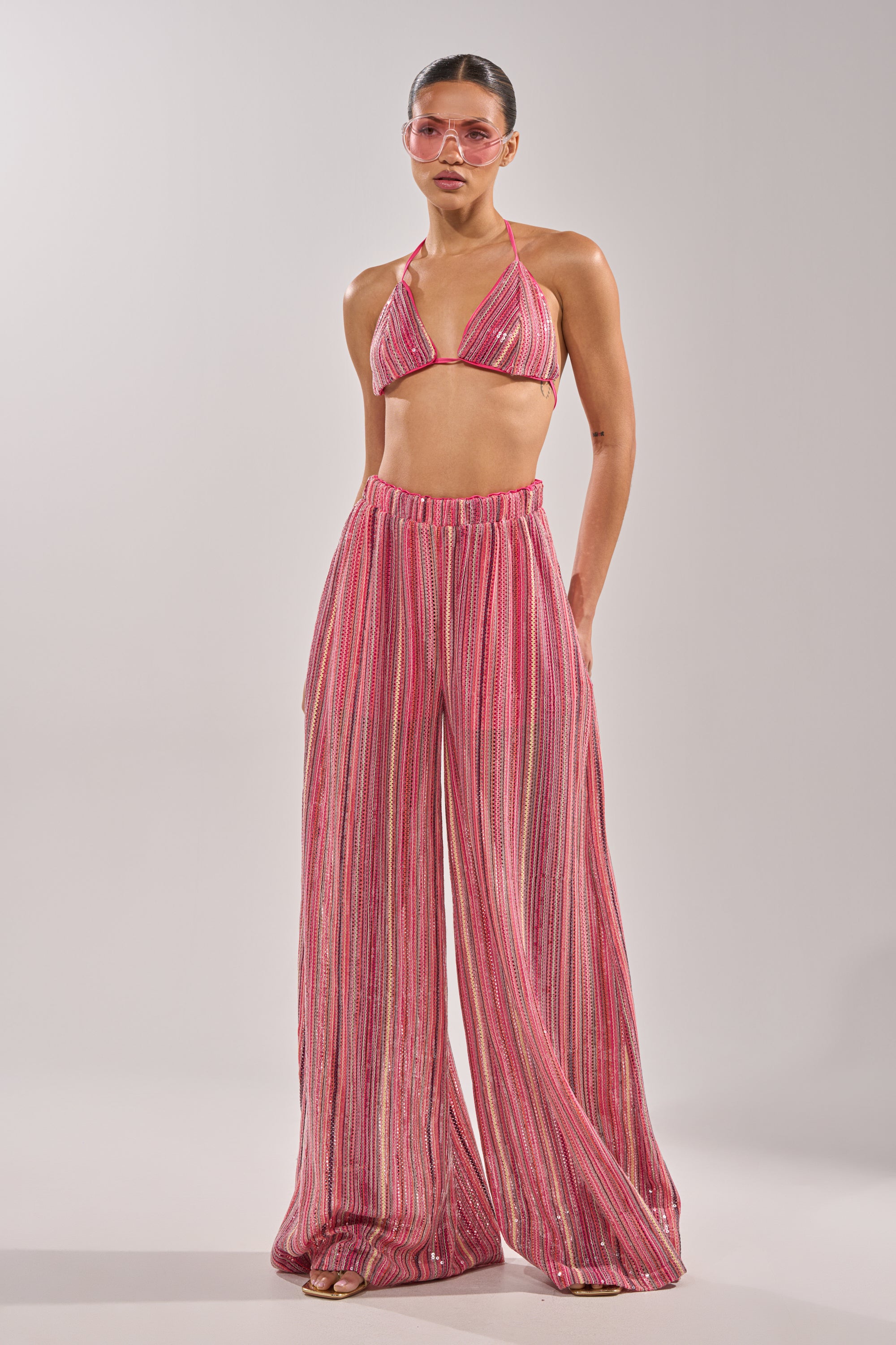 A woman wearing the TAYLOR SEQUIN BRALETTE. 8
