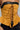The image showcases a close-up of a person wearing the NEW YORKS FINEST CORSET in mustard yellow leather, adorned with black trim. The corset features a peplum silhouette and is laced up at the front with multicolored strings. Paired with dark pants, only the torso is highlighted in this captivating shot.