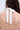 Close-up of a woman’s back with long brown wavy hair, wearing the DESTINY CORSET—a white halter top with straps tied in a bow at the neck. The background is plain and light-colored.