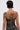 A person with short dark hair and tattoos models the DOWN AND DIRTY CAMO CORSET, a curve-hugging, camouflage-patterned strapless top, seen from behind against a plain background.