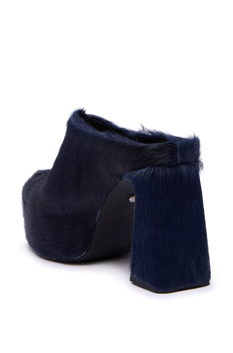 The AZALEA WANG GOLDING NAVY PONY HAIR CHUNKY PUMP is a high-heeled mule with a dark navy faux pony hair upper, platform sole, chunky block heel, and open back—perfect for making a bold statement with its modern design. 6