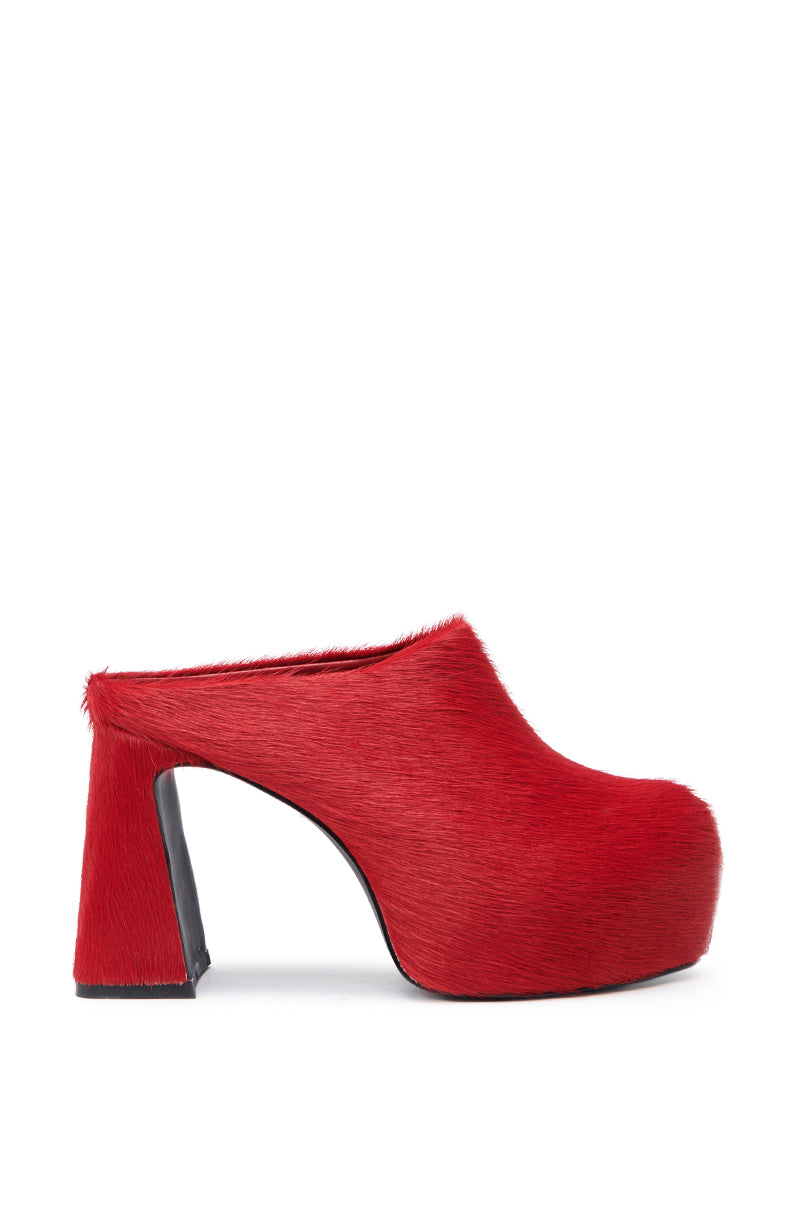 The AZALEA WANG GOLDING RED PONY HAIR CLOG PUMP features a modern chunky heel and platform sole, covered in bold red textured faux pony hair for standout style.