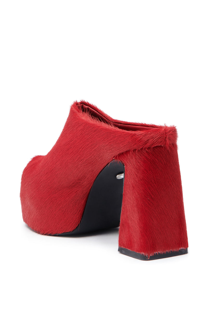 The AZALEA WANG GOLDING RED PONY HAIR CLOG PUMP features textured faux pony hair, a chunky heel, and a platform sole. Shown from the back on a white background.