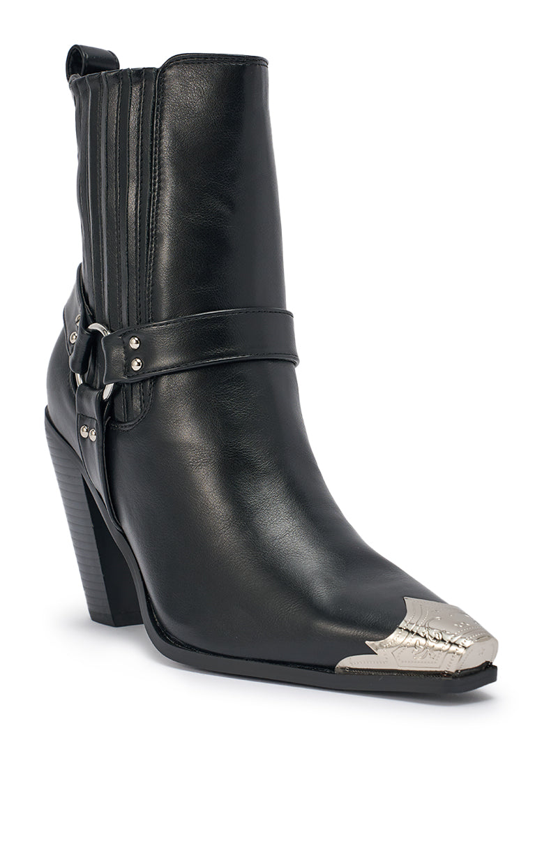The AZALEA WANG GOODMAN BLACK CHUNKY WESTERN HARDWARE PU BOOTIE features faux leather, a chunky heel, silver metal toe cap, harness strap, and side stitching detail, displayed on a white background. 5