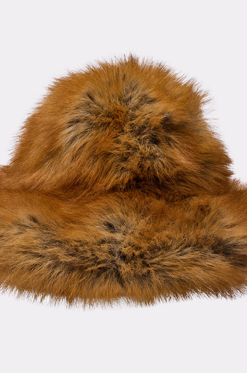 The HOT GIRL FAUX FUR OVERSIZED BUCKET HAT is a fluffy, brown winter accessory with black-tipped strands, crafted from soft faux fur and shown against a plain white background.