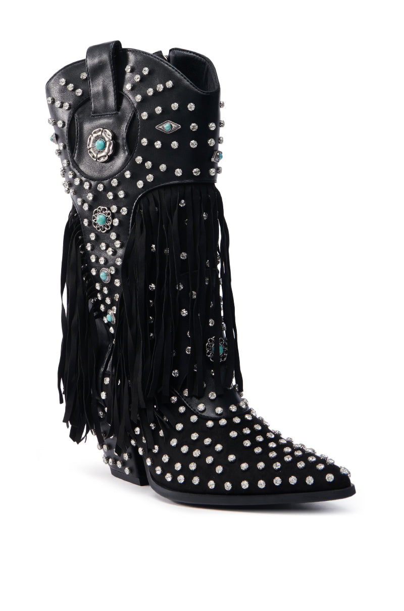 The AZALEA WANG GREYSON BLACK BOOTIE is a black rhinestone cowboy bootie embellished with silver studs, turquoise accents, fringe detailing, and features a pointed toe alongside decorative eye and floral motifs.