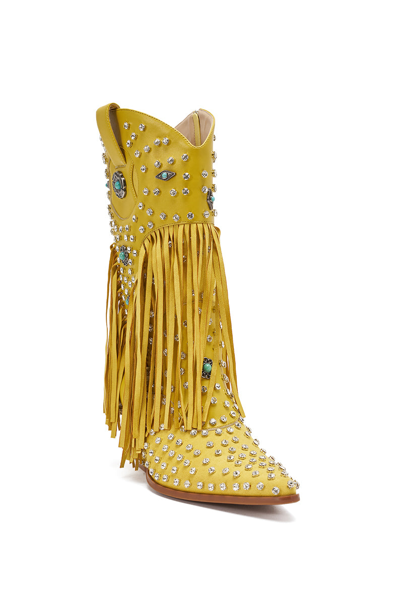The AZALEA WANG GREYSON Yellow Western Bootie features faux leather, silver studs, turquoise accents, long yellow fringe, rhinestone embellishments, a pointed toe, and a decorative Western-inspired design.
