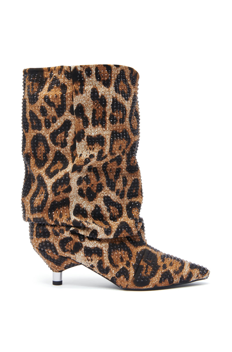 The AZALEA WANG GRIMES LEOPARD STILETTO BOOTIE is a slouchy mid-calf boot with a pointed toe, short kitten heel, bold leopard print, and sparkling rhinestone embellishments.