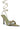 Introducing the Ground Work Sage Pointed Toe Silver Hardware Sandal: This elegant sandal features a pointed toe, a light green sole, and a beige upper embellished with metallic buckles. The long, slender ankle strap gracefully wraps around the leg, while the narrow black stiletto heel enhances its sophisticated style.