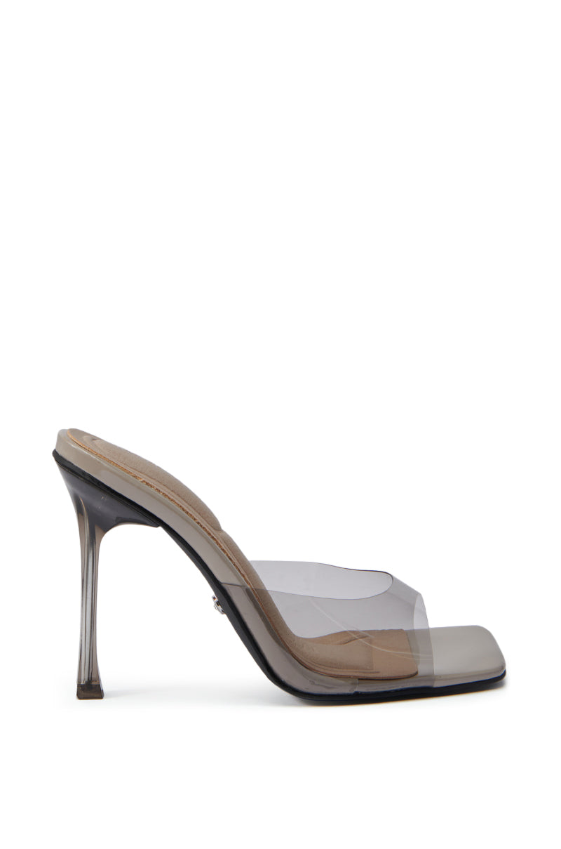 The AZALEA WANG GUILA GREY PVC SLIP ON SANDAL features a high transparent stiletto heel, a clear smoke-tinted strap, open square toe, and a beige insole.