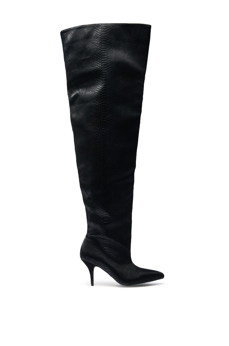 The AZALEA WANG HALINA BLACK SNAKE THIGH HIGH BOOT features a sleek, pointed toe and slender stiletto heel, showcased in black against a white background.