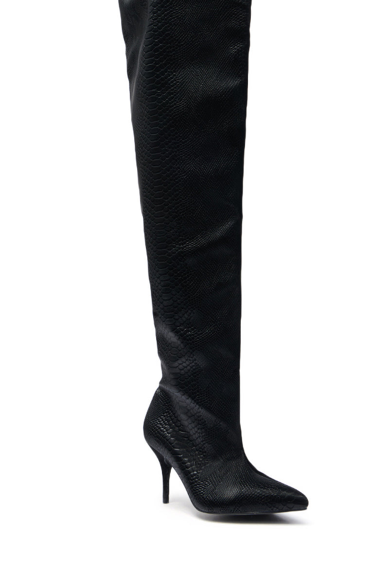 The AZALEA WANG HALINA BLACK SNAKE THIGH HIGH BOOT features a striking snakeskin pattern, pointed toe, and stiletto heel, shown as a single black boot on a white background.