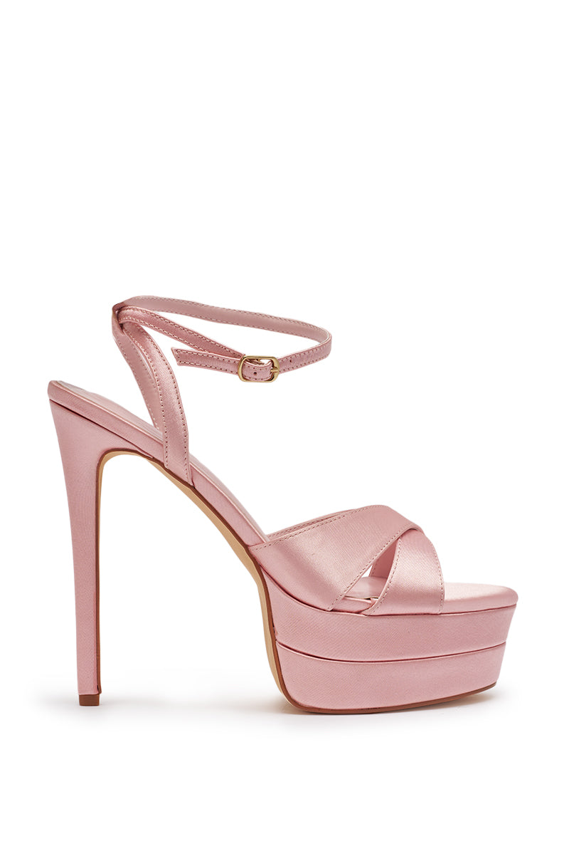 The AZALEA WANG HALLADAY Pink Satin Platform Stiletto Sandal features crisscross straps at the toe and an ankle strap with a small buckle, shown against a plain white background. 7