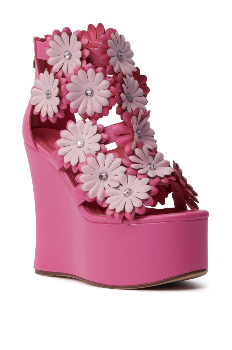 The AZALEA WANG Flower Embellished Wedge Sandal in Pink features 3D floral appliqués with gem centers, a high faux leather wedge heel, and an ankle strap with buckle for added style and support.