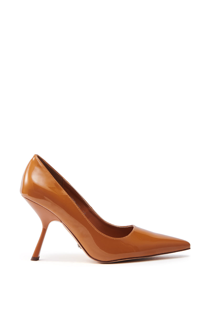 The AZALEA WANG HARTLEY NUDE PATENT PUMP features a sleek, shiny finish from the side view, highlighted by a pointed toe and slender stiletto heel.